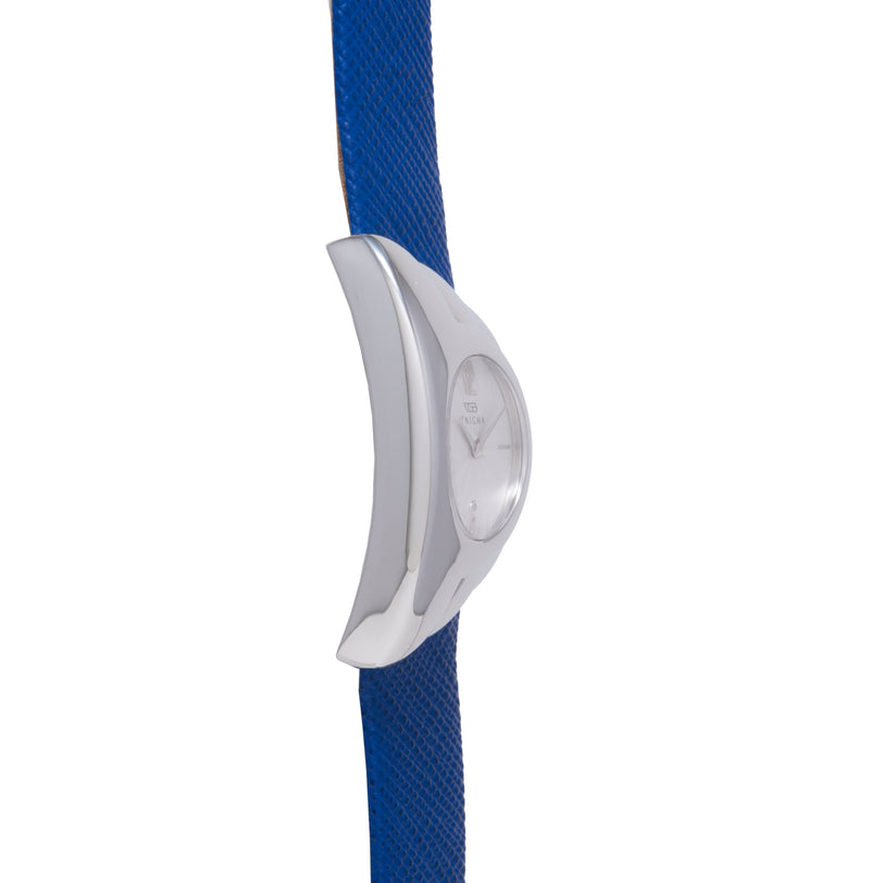 White curved watch with claw-shaped case on blue textured strap.
