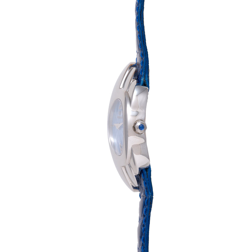 Silver watch case with blue dial and blue textured strap shown from the side.