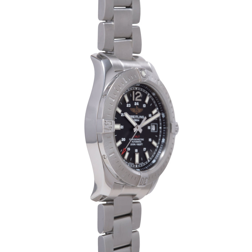 Stainless steel watch with black dial, Arabic numerals, date window, and matching metal bracelet.