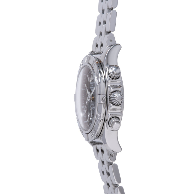 Stainless steel chronograph watch with three subdials, round dial, and linked metal bracelet, shown from side profile.