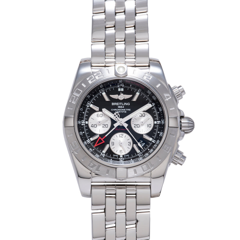 Stainless steel chronograph watch with black and white dial, multiple subdials, and linked metal bracelet.
