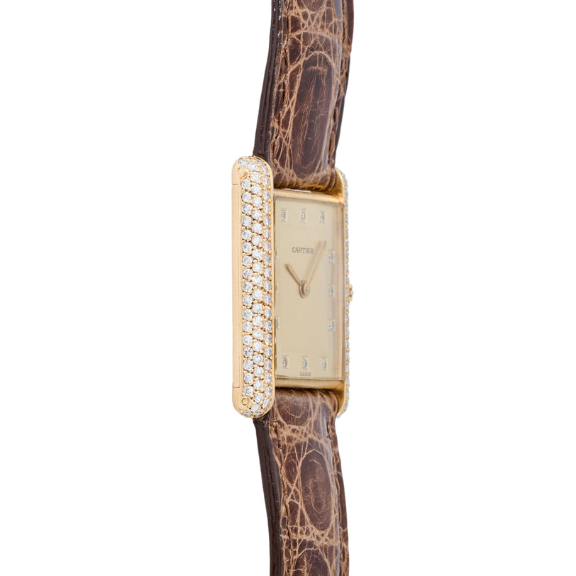 Cartier Tank LC watch with diamond-set yellow gold case and brown crocodile leather strap.