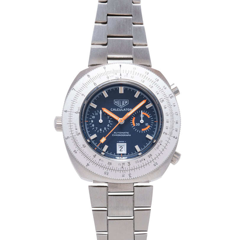 Steel Heuer Calculator chronograph watch with dark blue dial, orange hands and subdials, calculator bezel, and matching steel