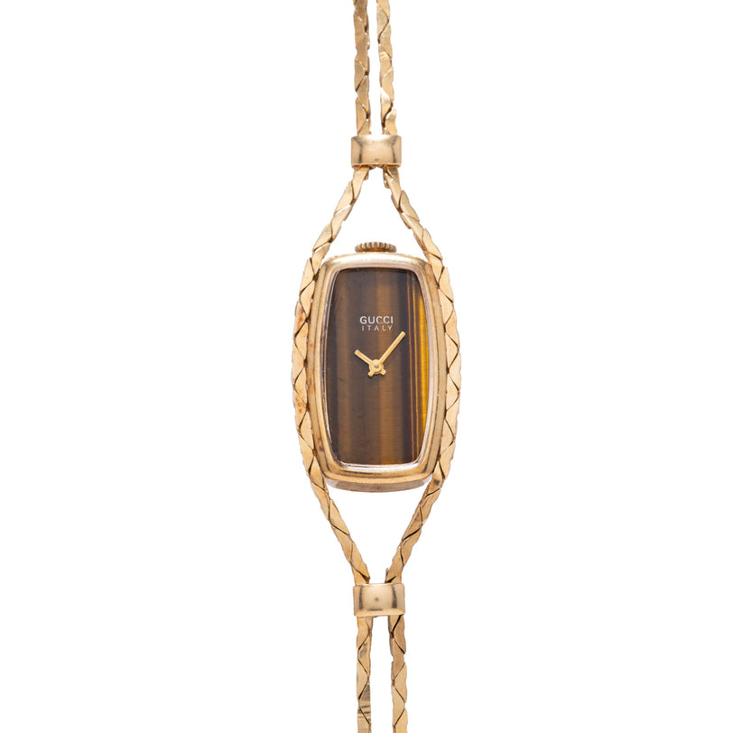 Gold-tone necklace with rectangular tiger's eye dial watch face, twisted chain links, and gold hands.