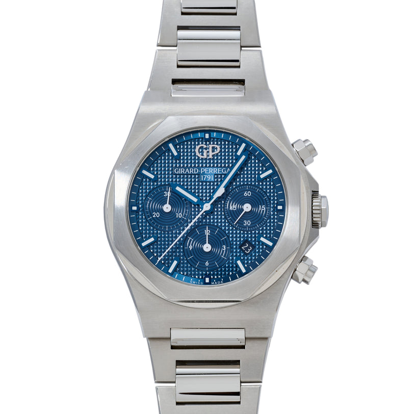 Stainless steel chronograph watch with blue dial, textured surface, and integrated metal bracelet.