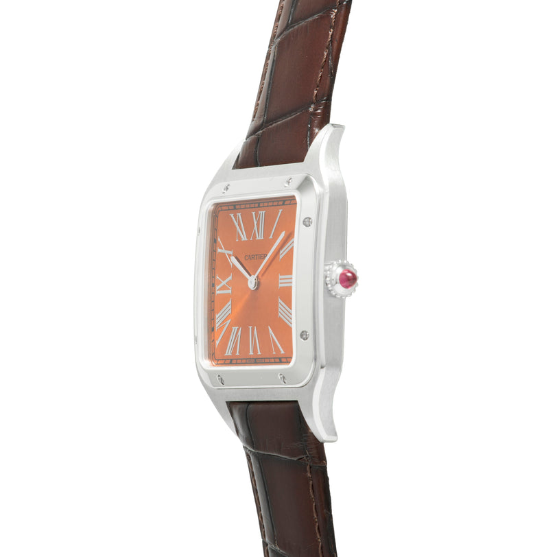 Silver-toned rectangular watch with orange dial, Roman numerals, brown leather strap and red crown jewel.