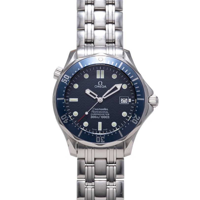 Stainless steel watch with dark blue dial, blue bezel, white hour markers, date window, and metal bracelet.