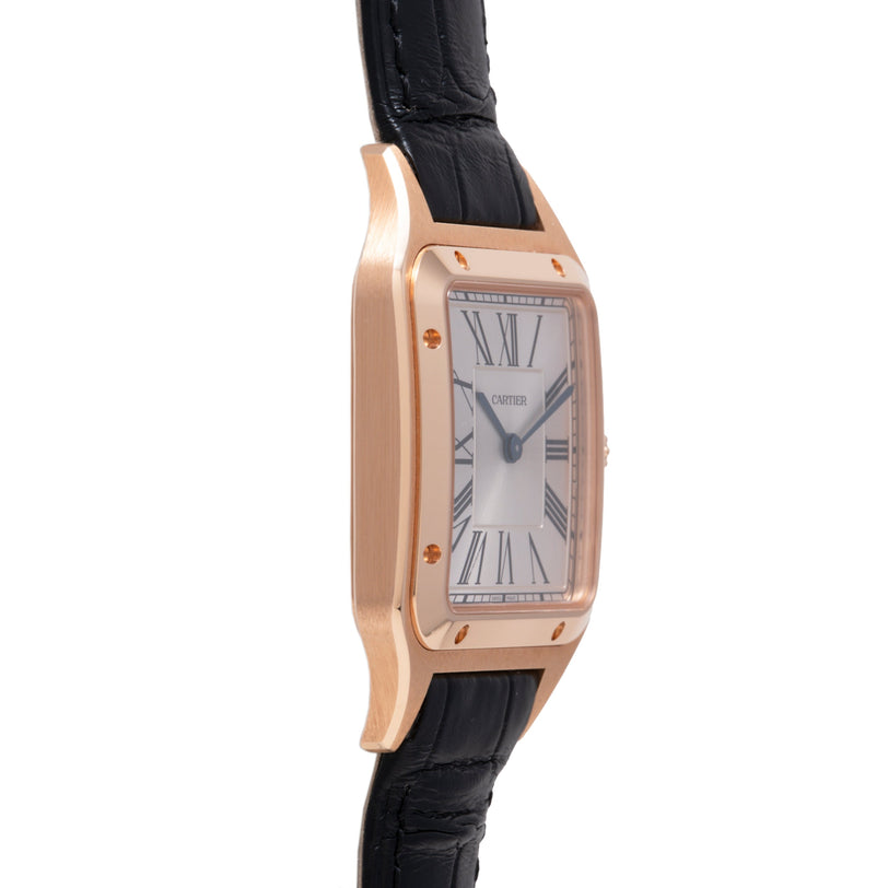 Rose gold rectangular watch with white dial, Roman numerals, and black leather strap.