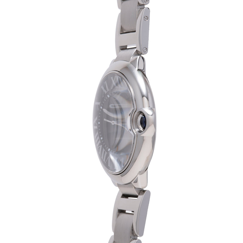 Stainless steel wristwatch with round dial, blue sapphire crown, and matching metal bracelet, shown from side angle.