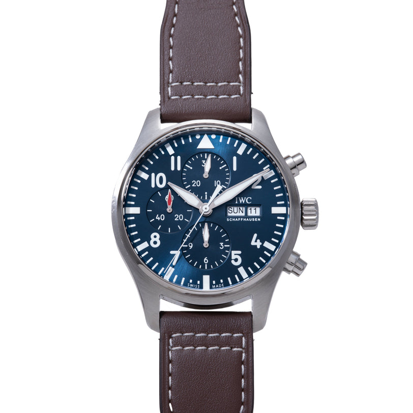 Stainless steel chronograph watch with blue dial, white numerals and hands, multiple subdials, day-date window, and brown lea