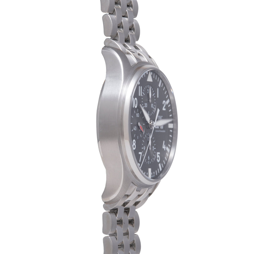 Stainless steel chronograph watch with black dial, Arabic numerals, and linked metal bracelet shown from side angle.