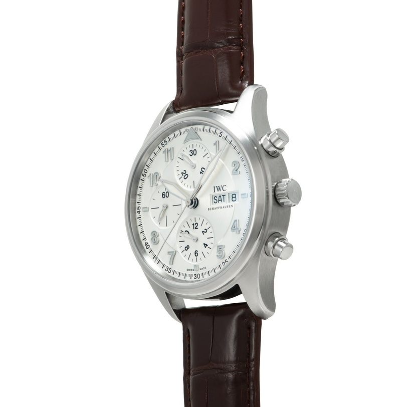 Silver-toned chronograph watch with white dial, multiple subdials, day-date window, and brown leather strap.