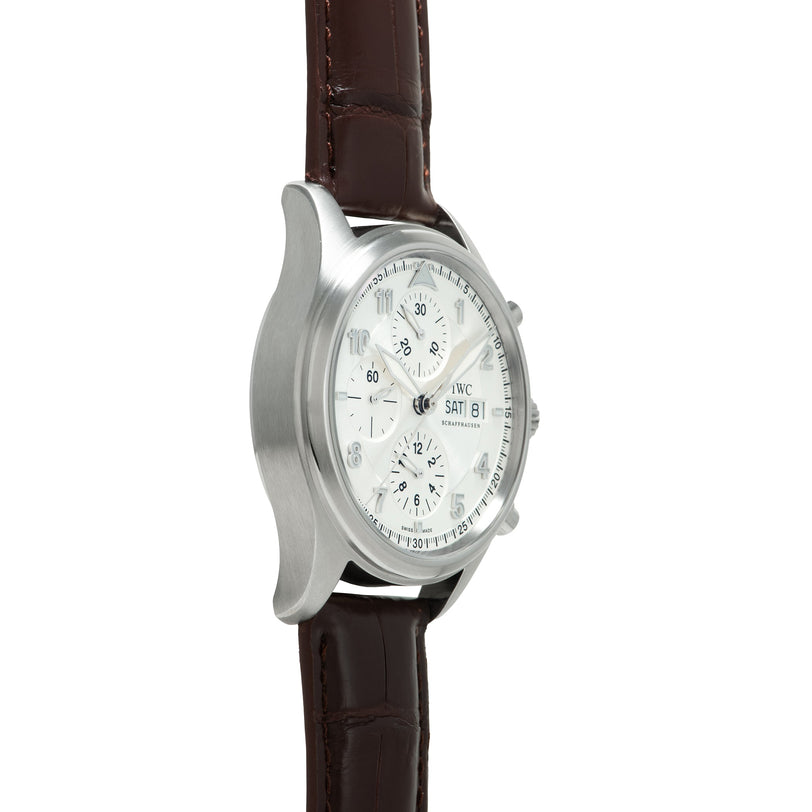 Silver-toned chronograph watch with white dial, multiple subdials, and dark brown leather strap.