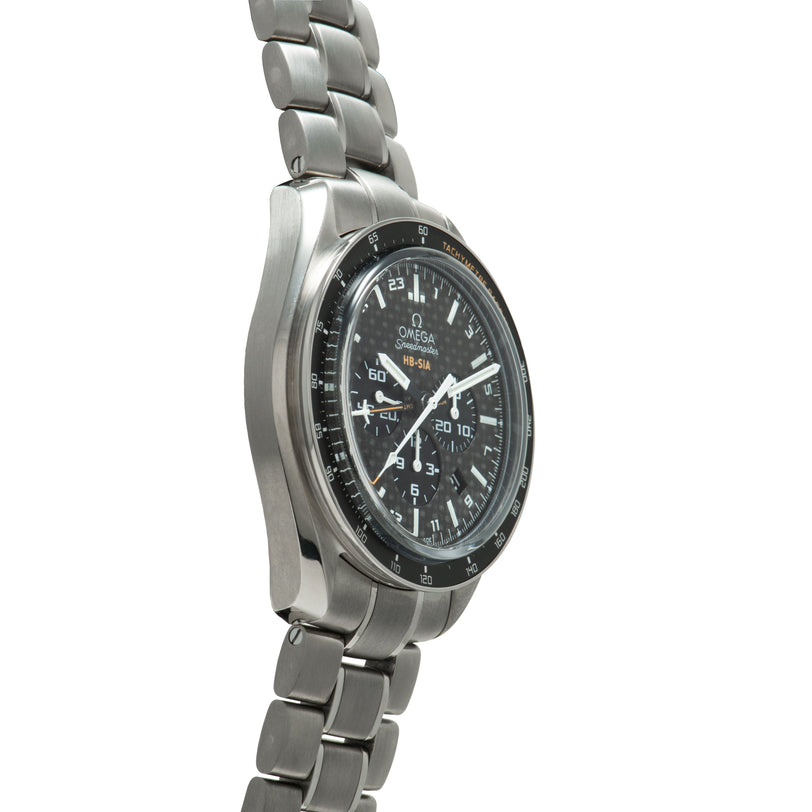 Titanium Speedmaster chronograph watch with black dial, tachymeter bezel, and matching titanium bracelet.