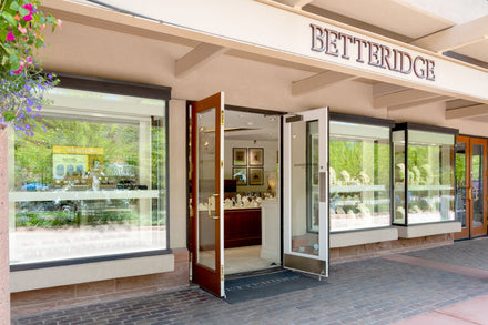 Exterior of Betteridge jewelry store with glass displays and open double doors inviting customers inside.