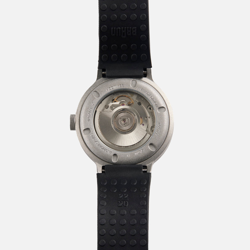 Back view of the Braun BN0279 Sub-Seconds Limited Edition For Hodinkee wristwatch, featuring a visible mechanical movement and a black rubber strap.