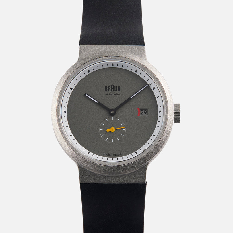 Braun BN0279 Sub-Seconds Limited Edition for Hodinkee wristwatch with a grey face, black strap, date display, and yellow detail on the small subdial.