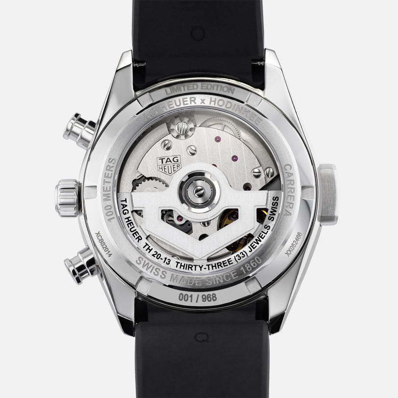 Close-up of the TAG Heuer Carrera Chronograph Seafarer × Hodinkees transparent case back, revealing the movement and special engravings.