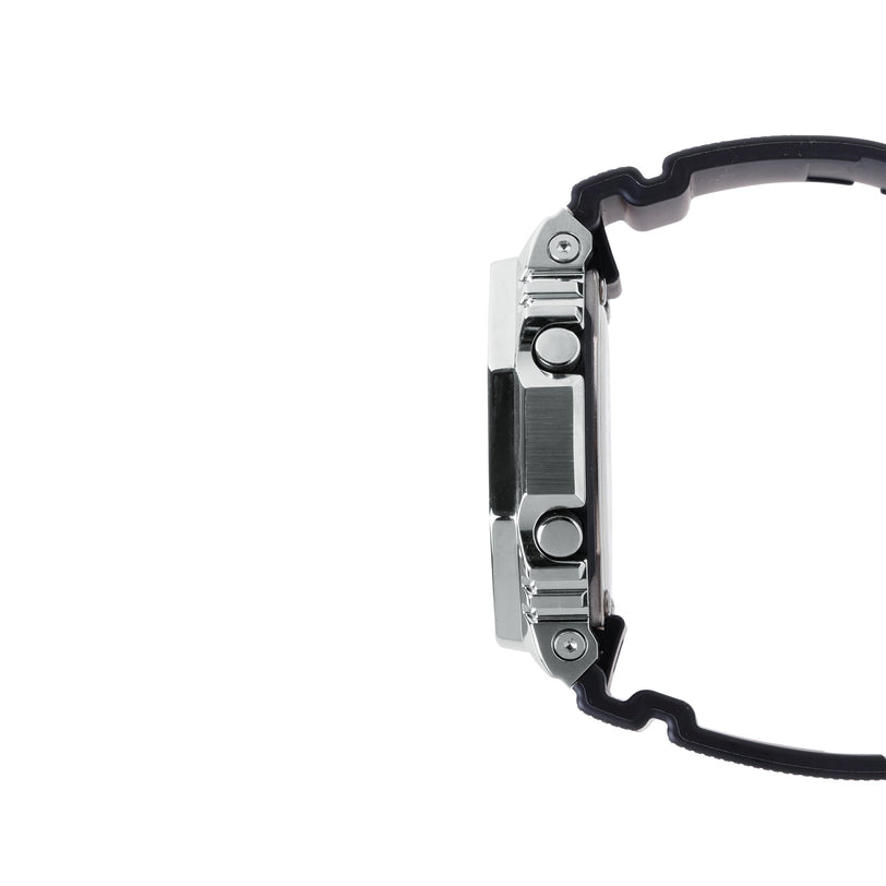 Digital watch with silver stainless steel case, black resin band, and multiple buttons on the side.