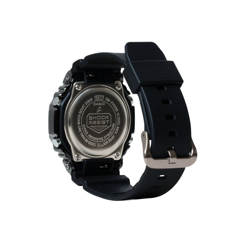 Casio G-Shock digital watch with black resin band and stainless steel case back shown from rear angle.