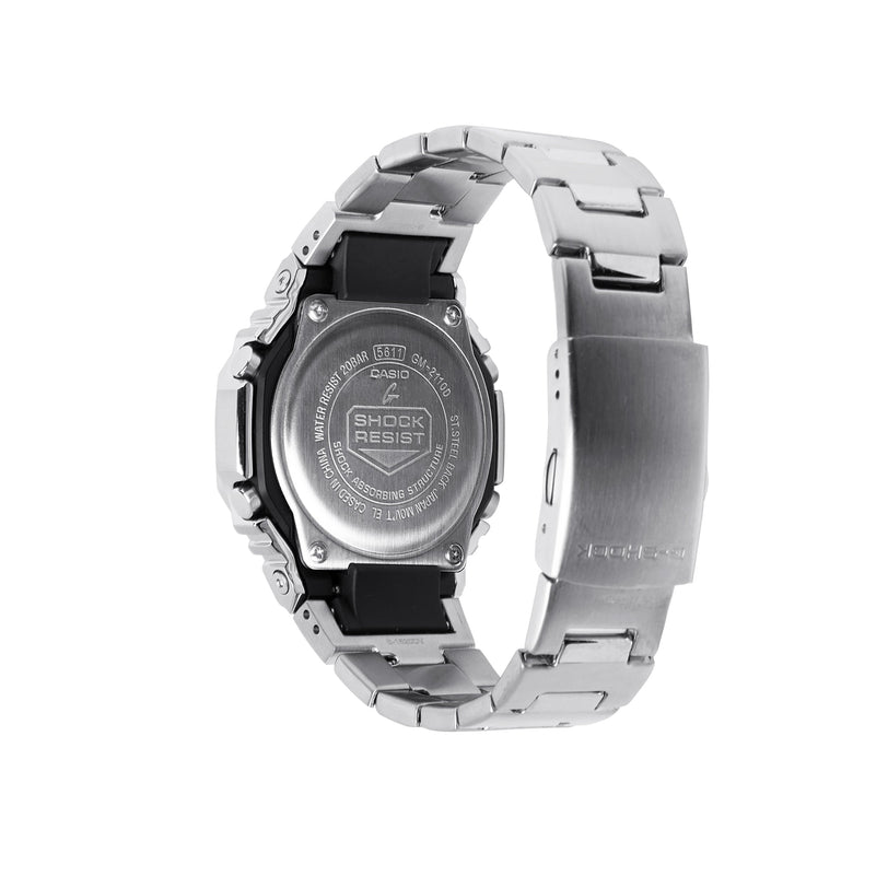Digital watch with silver stainless steel band and black resin bezel, shown from back view displaying "Shock Resist" text.