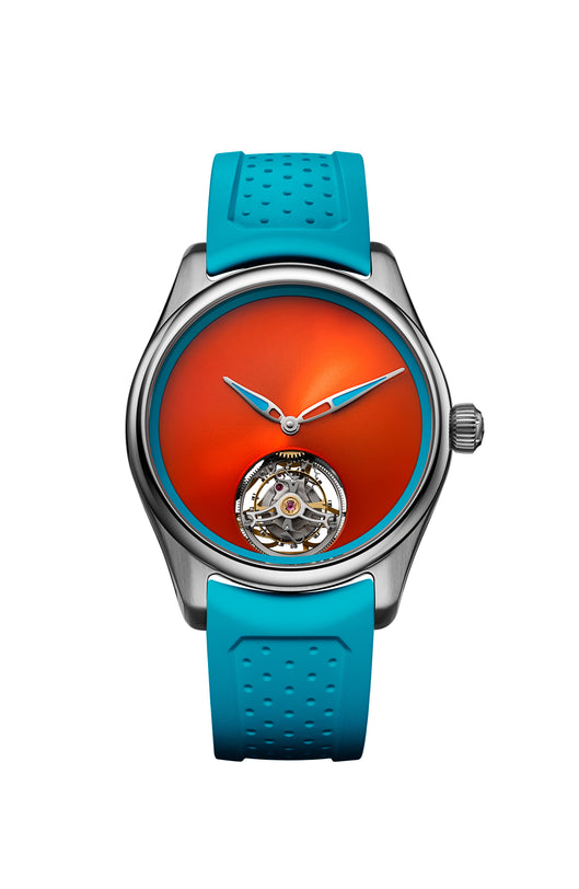 The H. Moser & Cie Pioneer Centre Seconds Spiced Aqua features a bright orange face, an exposed tourbillon, and a blue strap, displayed against a white background.
