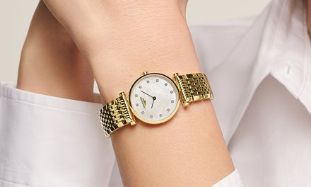 Longines La Grande Classique watch with diamond hour-markers and a gold bracelet