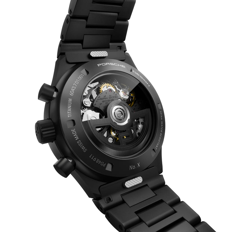 Porsche Design Chronograph 1 All Black Numbered Edition features a visible mechanical movement, titanium case back, and comes on a black metal bracelet.