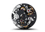 Close-up of the Chronograph 1 All Black Numbered Edition by Porsche Design, showcasing its intricate mechanical movement with visible gears, springs, and components.