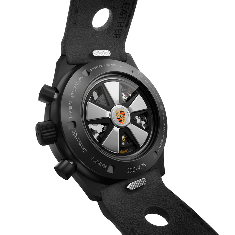 Close-up of the Chronograph 1 75 Years Porsche Edition by Porsche Design, showing gears and the Porsche crest on the rotor.