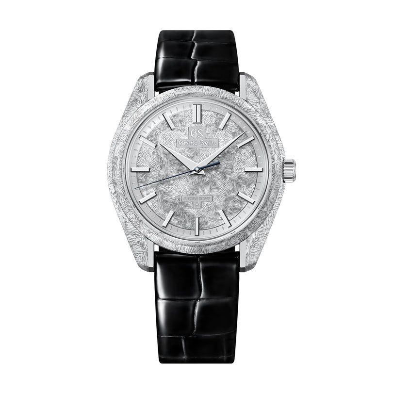 Silver tonneau watch with textured dial, applied hour markers, and black crocodile leather strap.