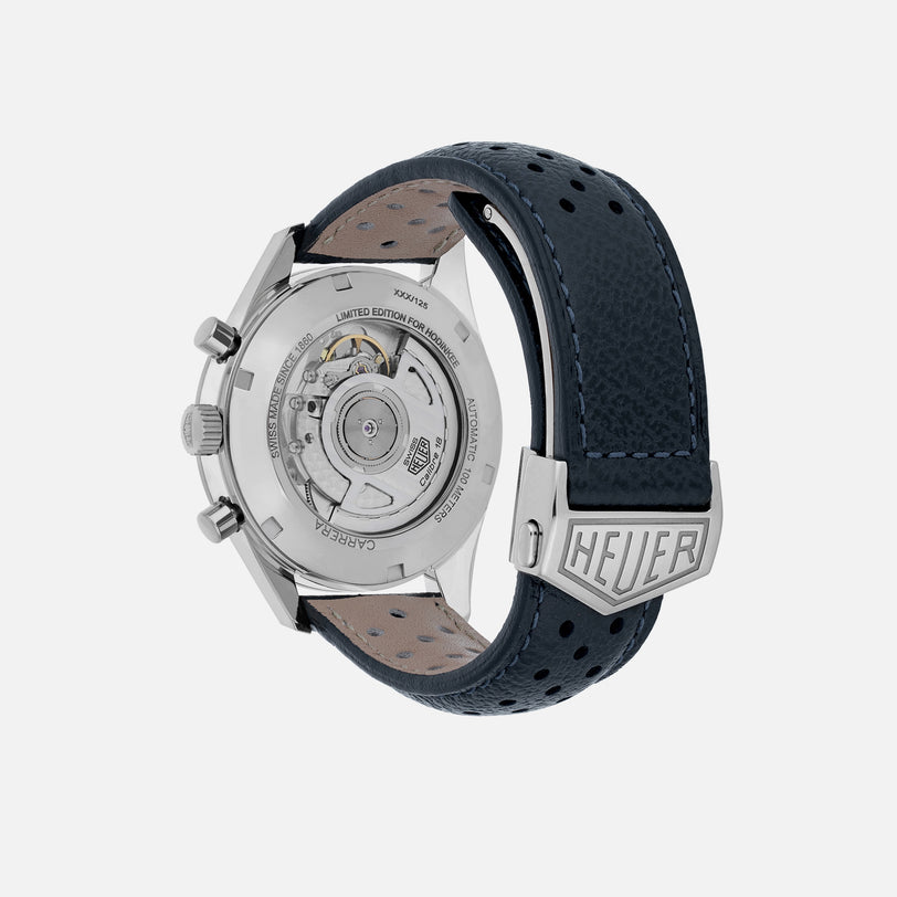 The back view of the TAG Heuer Limited Edition Carrera Skipper For HODINKEE showcases its automatic movement, stainless steel case, and black perforated leather strap—a must-have for collectors and vintage chronograph enthusiasts.