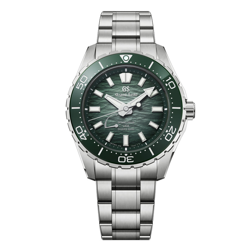 Grand Seiko diver watch with green dial, green bezel, and stainless steel bracelet.
