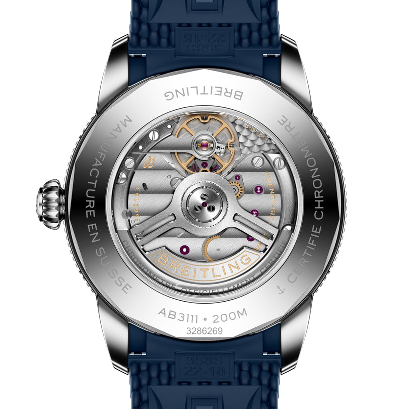 Close-up of a Breitling Superocean Heritage B31 Automatic 42, revealing its intricate mechanical movement through the transparent case back and featuring a blue strap.