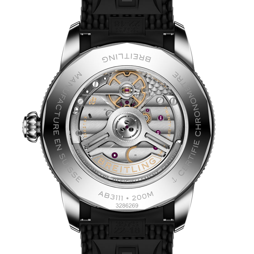 Close-up of the Breitling Superocean Heritage B31 Automatic 42’s transparent case back revealing intricate mechanical movement and detailed engravings.