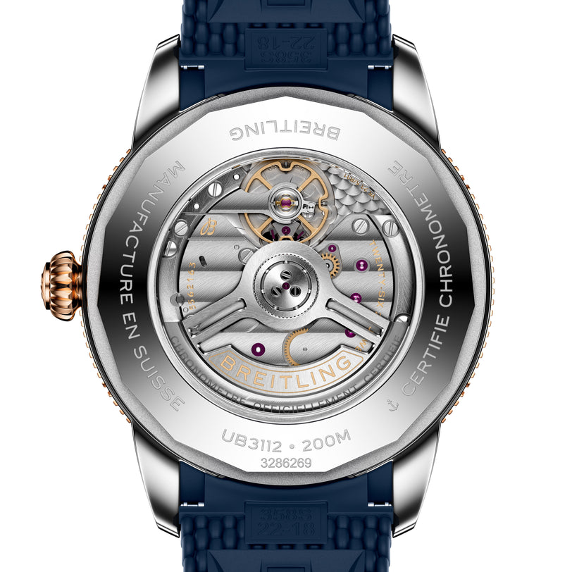 Close-up of the Breitling Superocean Heritage B31 Automatic 44’s transparent case back, showcasing its detailed mechanical movement and engraved markings.