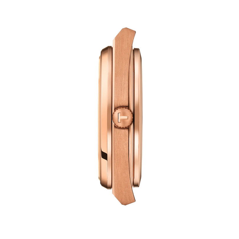 Side view of the Tissot PRX Powermatic 80 40mm rose gold wristwatch case with a crown displaying the T logo, set against a black background.
