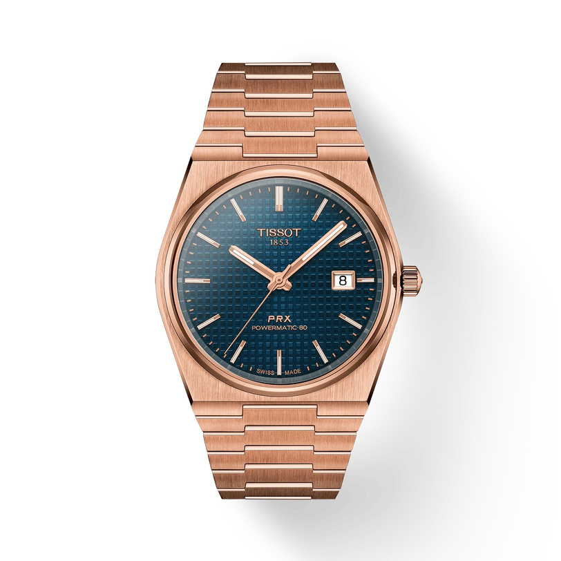 The Tissot PRX Powermatic 80 40mm features a rose gold finish, blue textured dial, date display, and a metal bracelet.