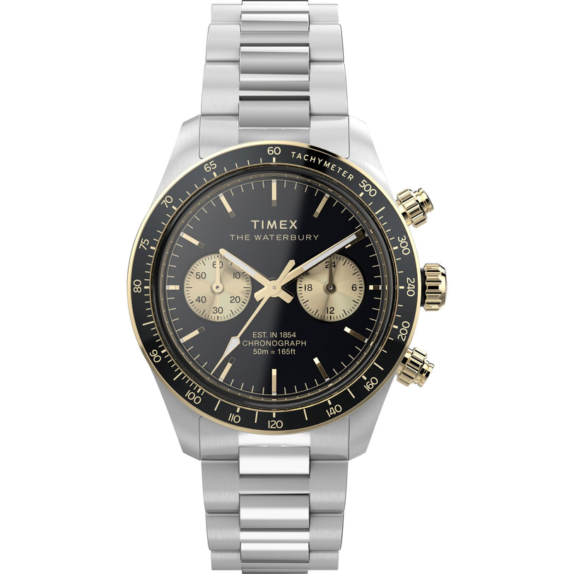 The Timex Waterbury Heritage Chronograph features a stainless steel case, black dial with three subdials, gold-tone accents, and a tachymeter bezel, shown elegantly against a white background.