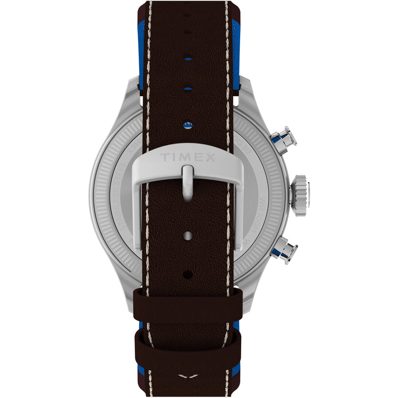 Back view of the Timex x Pan Am® Waterbury Ace Chronograph featuring a dark brown leather strap with white stitching, blue accents, and a silver engraved TIMEX buckle. The stainless steel case and two push buttons are also partially visible.