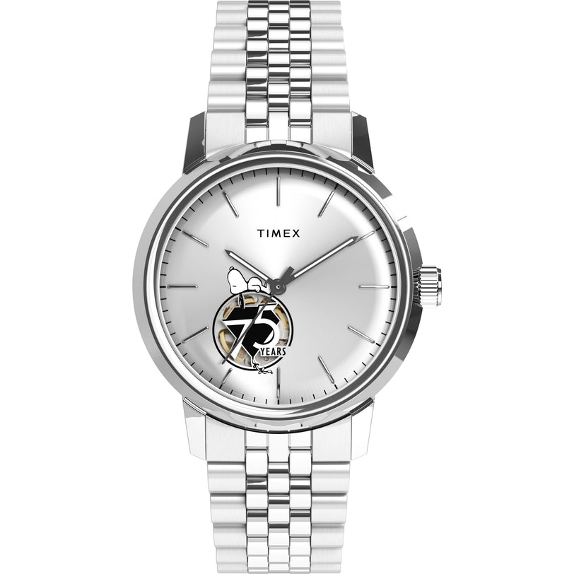 The Timex x Peanuts® Marlin® Automatic 75th Anniversary watch features a silver case, white dial, and a small Snoopy illustration with "75 Years" near 6 o’clock, celebrating Peanuts’ 75th anniversary.