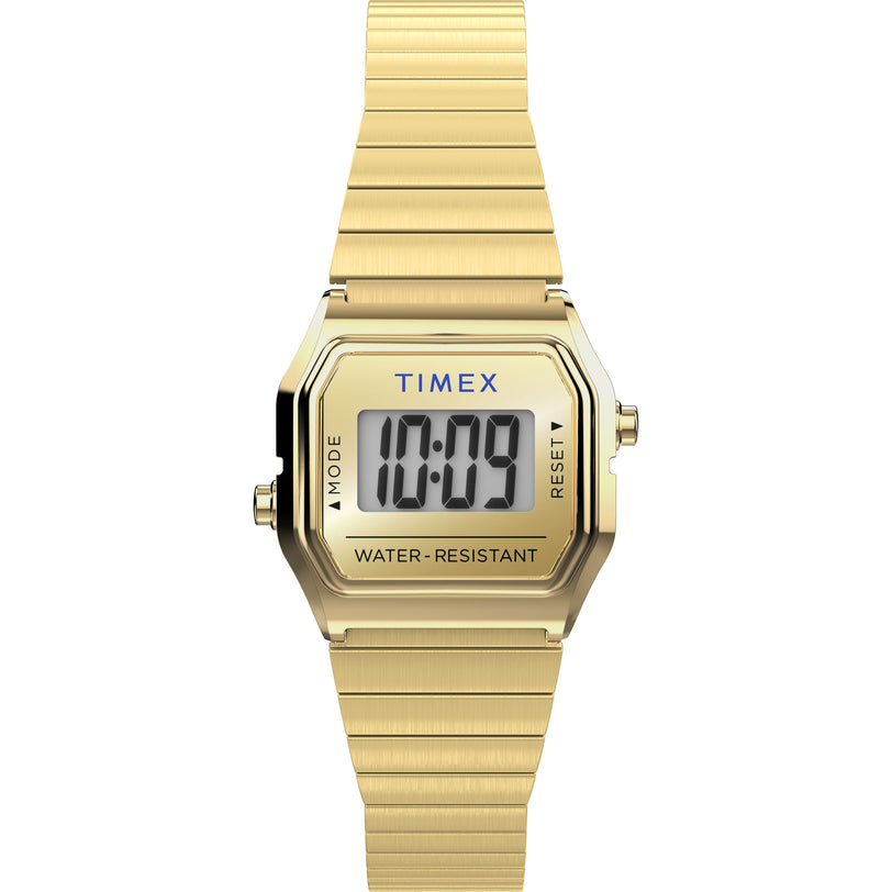 The Timex L SS QZ BW TEENY TINY 20 GLD DL/STP 25 is a gold digital wristwatch with a rectangular face showing 10:09, stainless-steel case, metal link band, and "Water Resistant" labeled on the face.