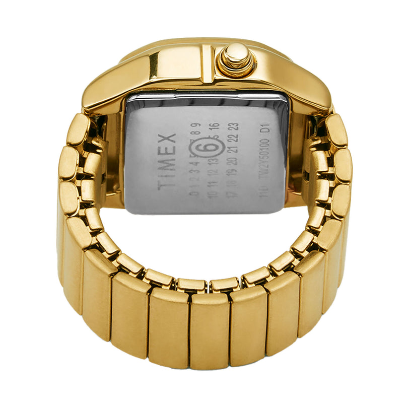 The MM6 Gold Tone Digital Ring Watch by Timex is shown from the back, highlighting its metallic band and stainless steel case back with manufacturer details and serial numbers.