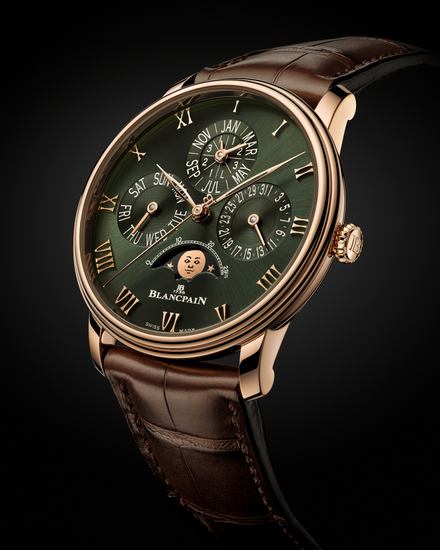 Close up of the Blancpain Villeret watch with a green metallic dial and three subdials over a black gradient background
