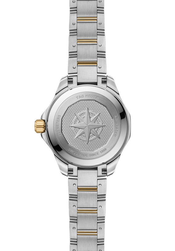 Silver and gold TAG Heuer Aquaracer Professional 200 Solargraph watch back featuring a compass rose engraving and brand details.
