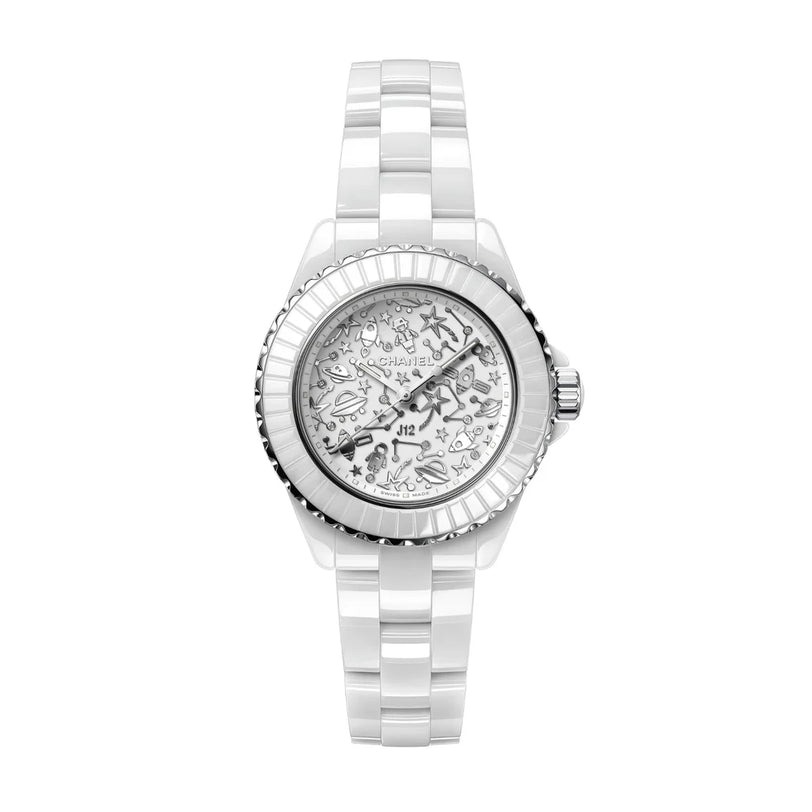 The Chanel J12 Cosmic is a white ceramic watch with a silver bezel and a patterned dial featuring whimsical illustrations, paired with a linked bracelet strap for an elegant look inspired by the classic original.