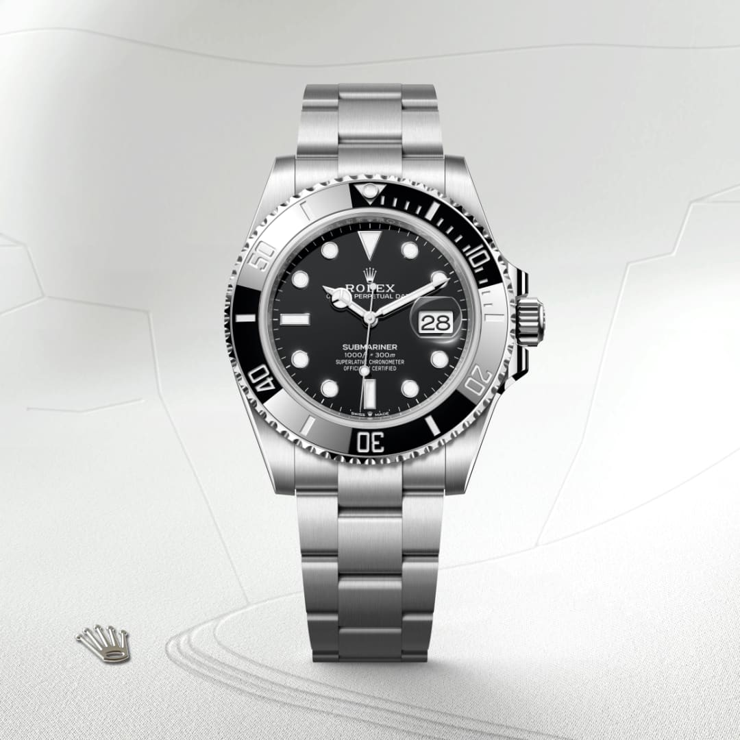 A stainless steel Rolex Submariner watch with a black dial and bezel displayed on a light textured background.