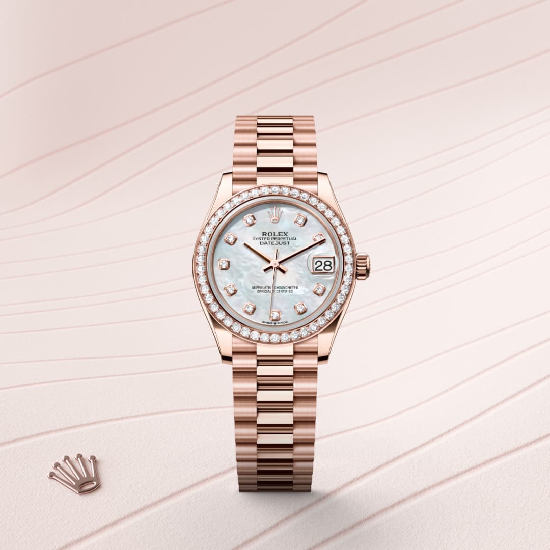 A rose gold Rolex watch with a diamond bezel and light blue face, displayed on a textured cream background.