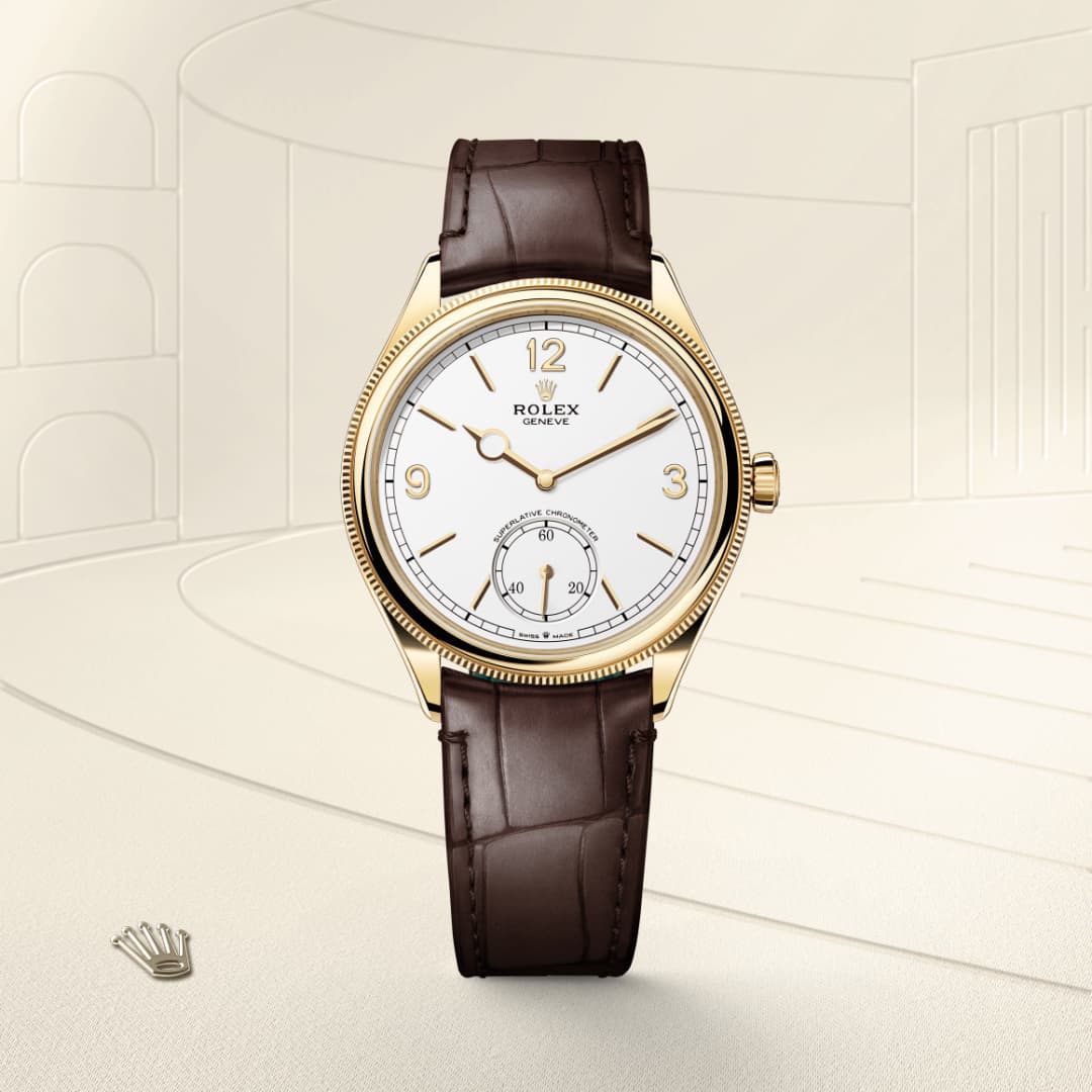 Rolex watch with a brown leather strap and gold case displayed on a cream background.