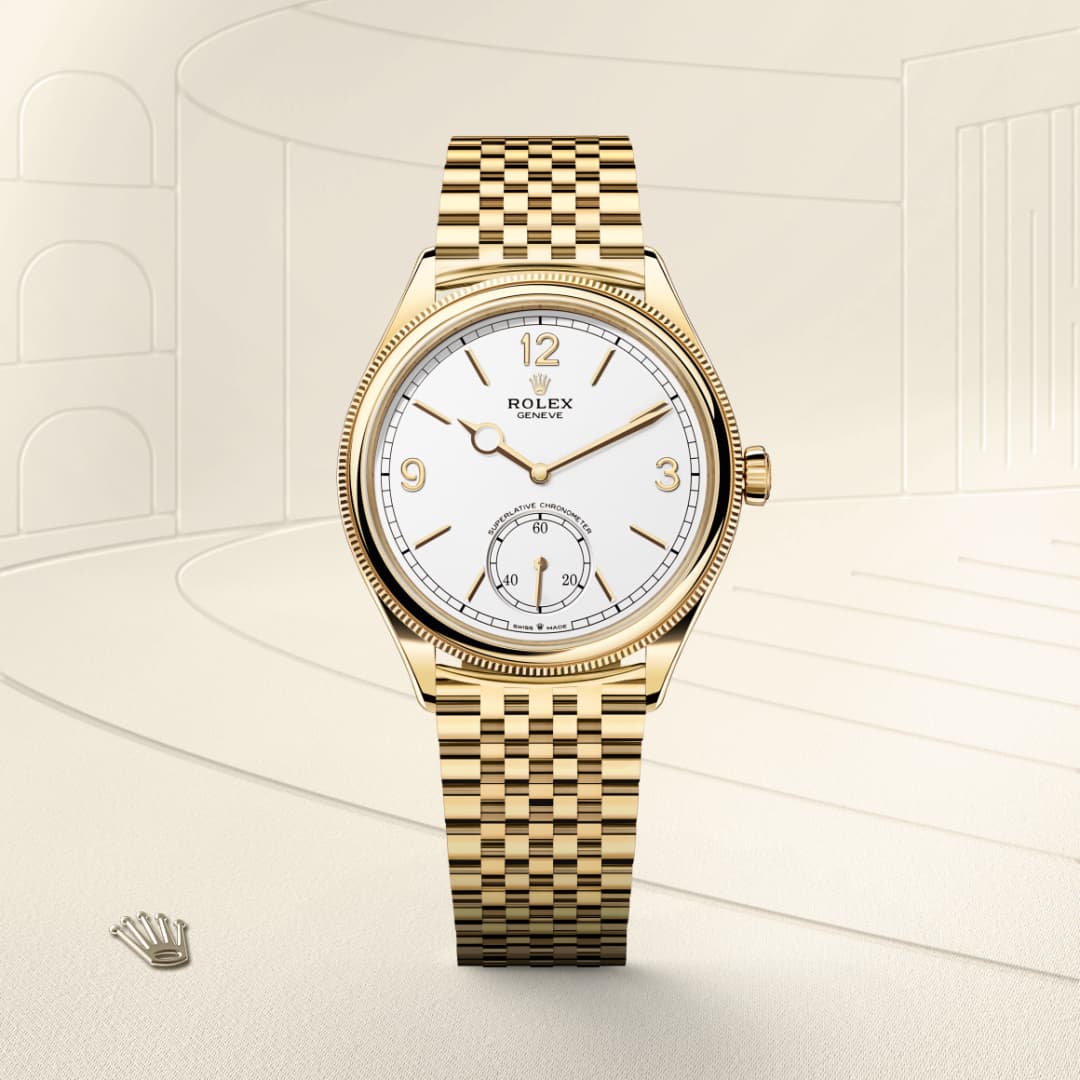 Gold Rolex wristwatch with a white dial, gold numerals, and a gold bracelet on a beige background.